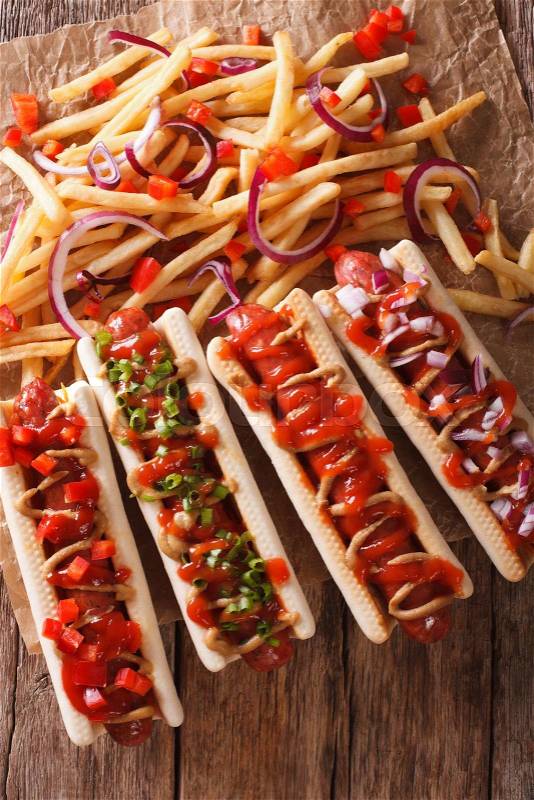 A variety of freshly made hot dogs macro on the table. vertical view from above\, stock photo
