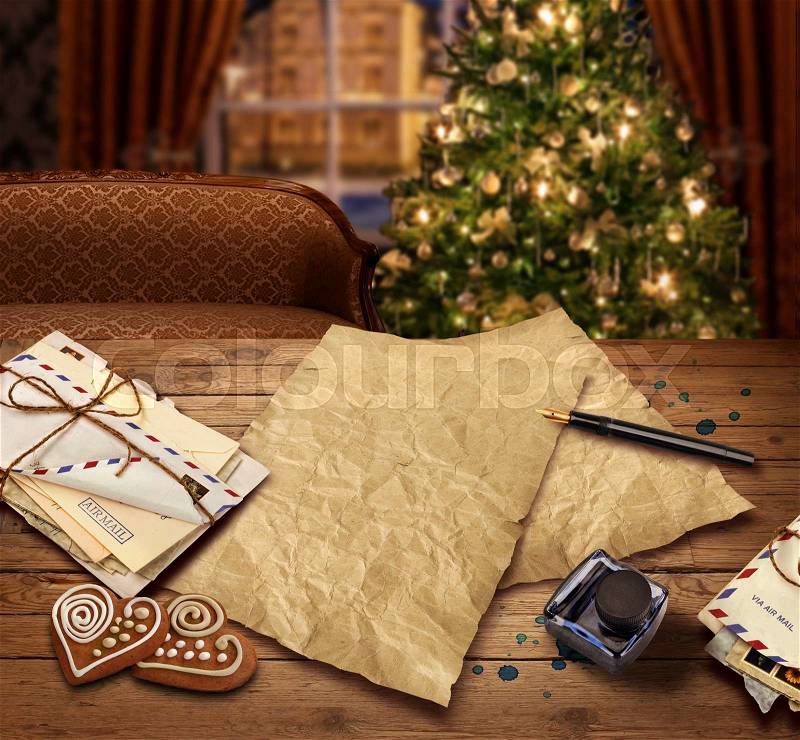Christmas wish present list letter to Santa on christmas tree background, stock photo