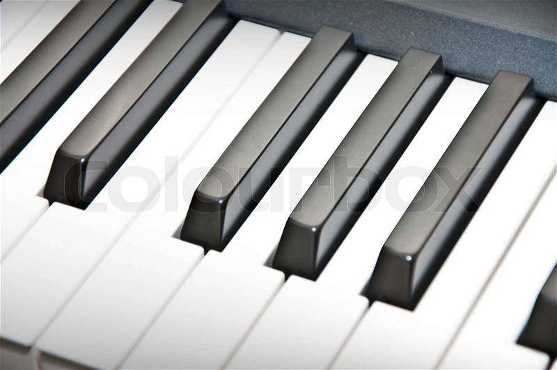 Close up shot of black & white piano keys, stock photo