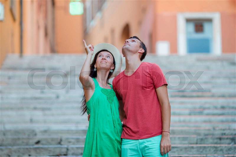 Romantic couple on Steps in Rome enjoy italian holidays. Happy lovers walking on the travel landmark tourist attraction, stock photo