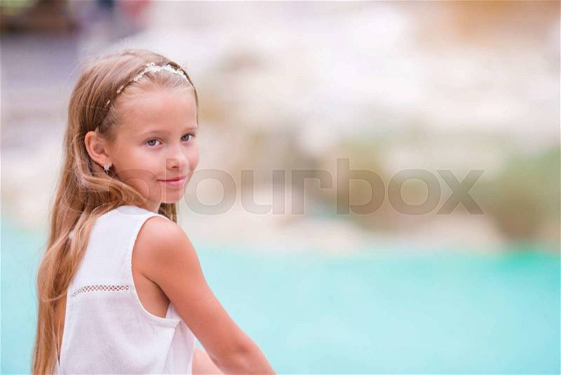 Adorable little girl background Trevi Fountain, Rome, Italy. Happy toodler kid enjoy italian vacation holiday in Europe, stock photo