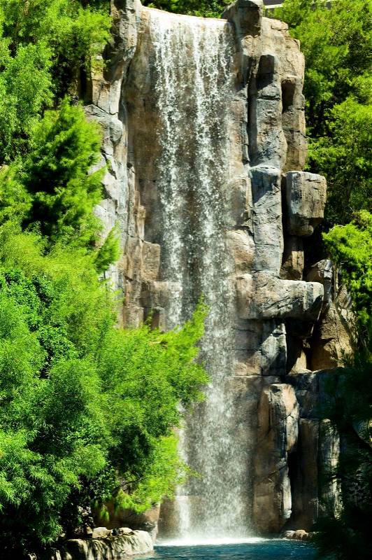 Tall waterfalls on the bright summer day, stock photo
