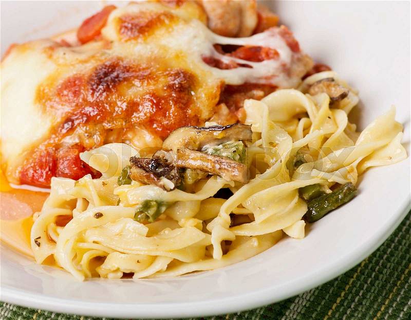 Pasta with Green Beans and Mushrooms and Parmesan Chicken, stock photo