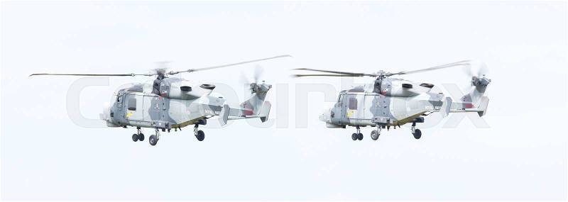 LEEUWARDEN, THE NETHERLANDS - JUNE 11, 2016: Royal Navy (Black Cats Display Team) Agusta Westland AW-159 Wildcat HMA2 performing some flights at the Royal Netherlands Air Force Days, stock photo
