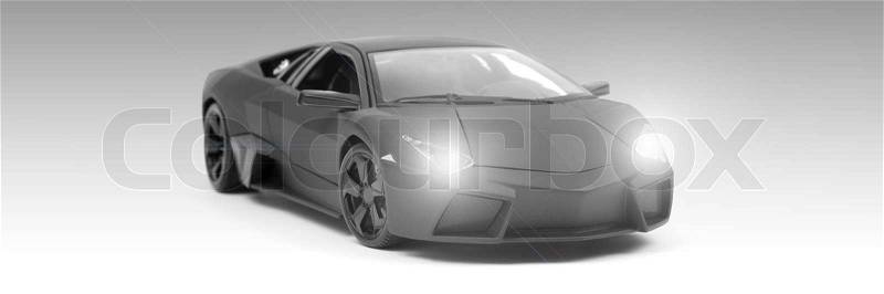 A model sports car isolated against a white background, stock photo