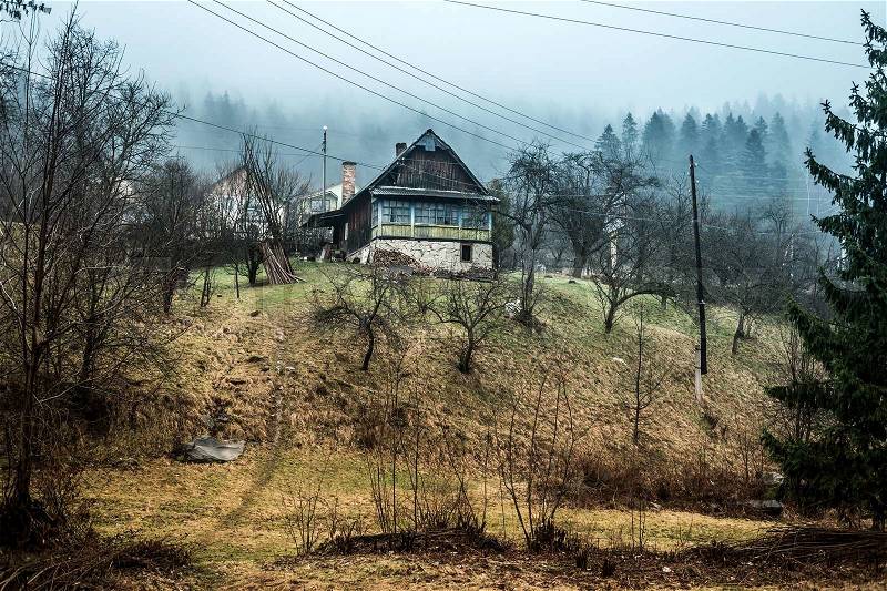 Beautiful landscape with house on hill in Carpathians, Ukraine, stock photo