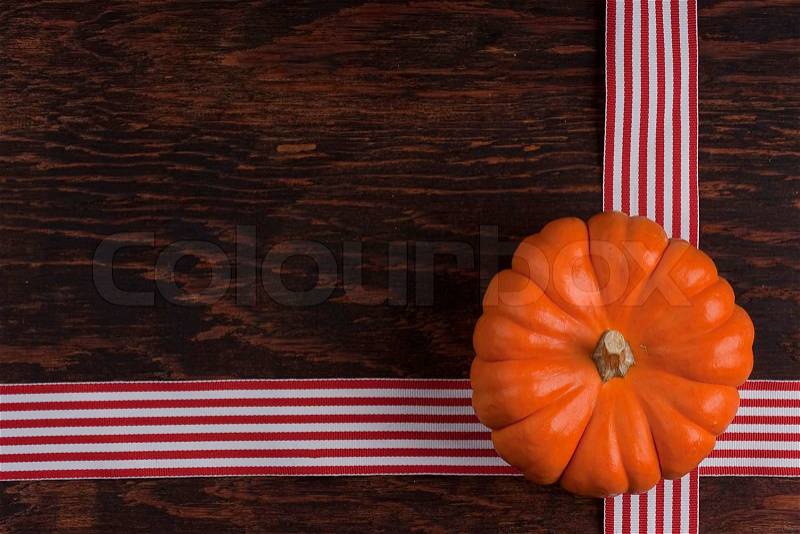 Small orange pumpkins symbolising autumn holidays and used in decorative works, stock photo