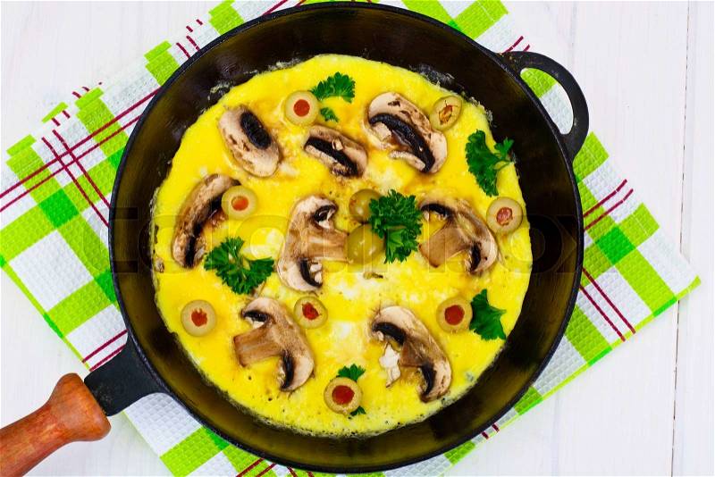 Healthy and Diet Food: Scrambled Eggs with Mushrooms and Vegetables. Studio Photo, stock photo