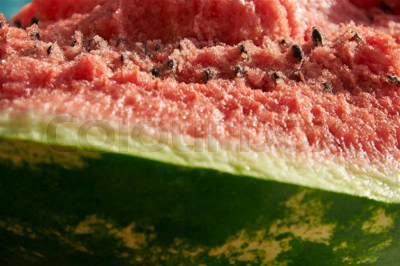 Big piece of red juicy smashed watermelon, stock photo