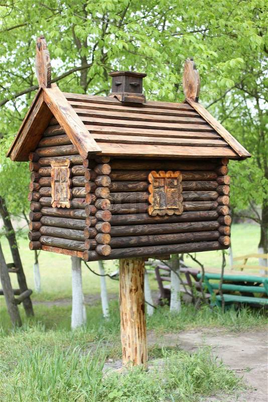 Toy house in the woods . A hut on chicken legs, stock photo