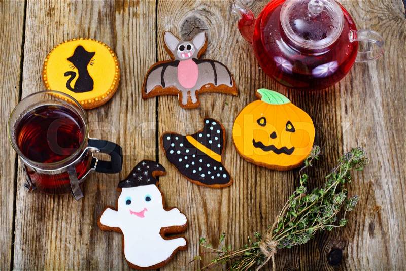 Gingerbread for Halloween with Red Tea. Funny Holiday Food for Children.Studio Photo, stock photo