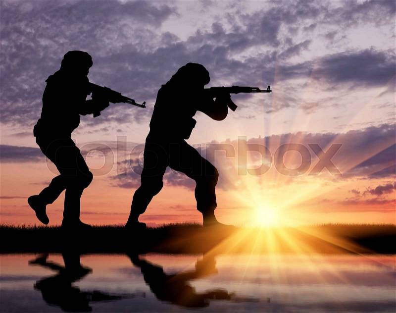Terrorism and conflict. Armed terrorists and theirs at sunset reflected in water, stock photo