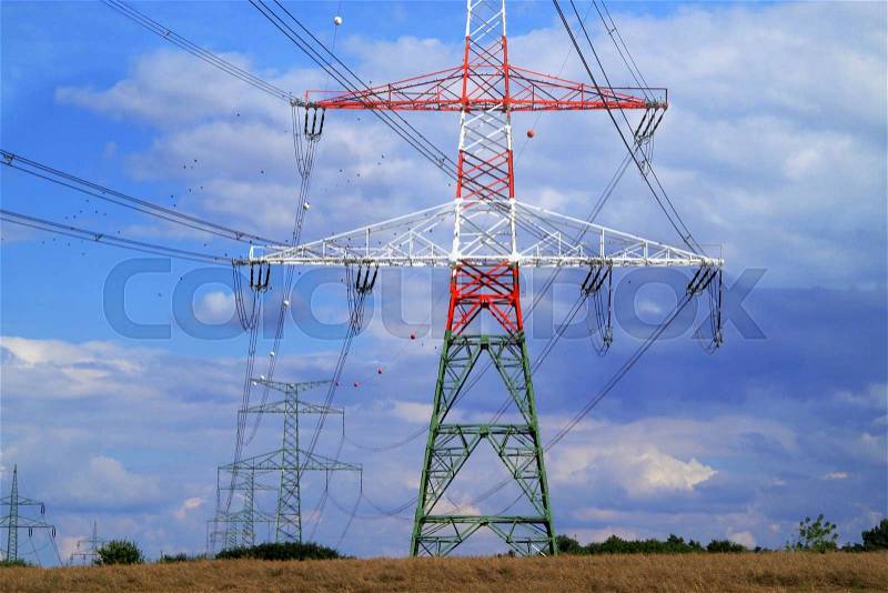 High electricity pylons in the pasture in Czech Republic, stock photo