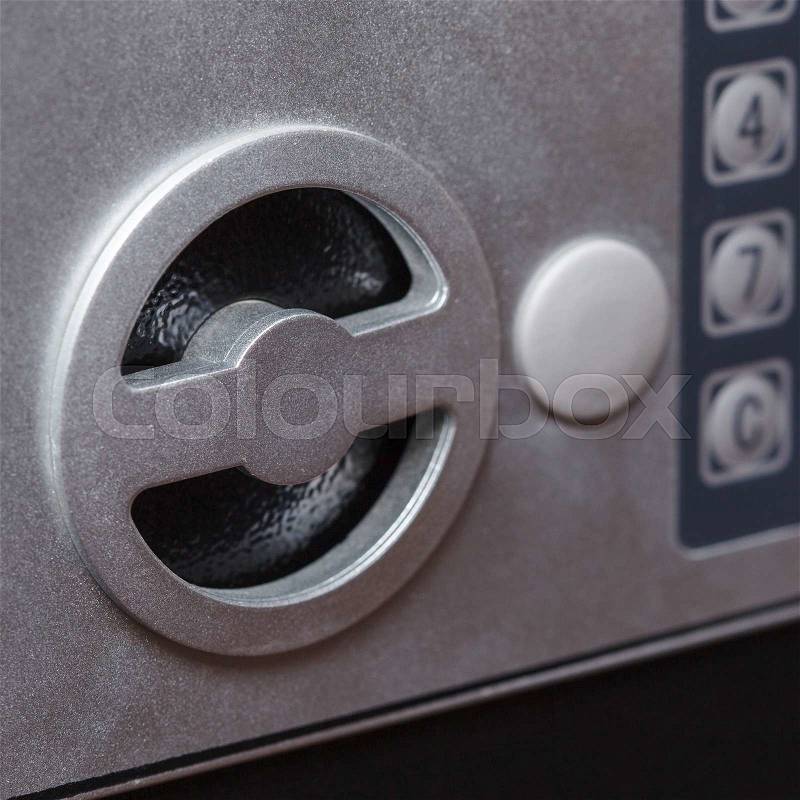 Electronic home safe keypad, Small home or hotel wall safe with keypad, closeup, stock photo