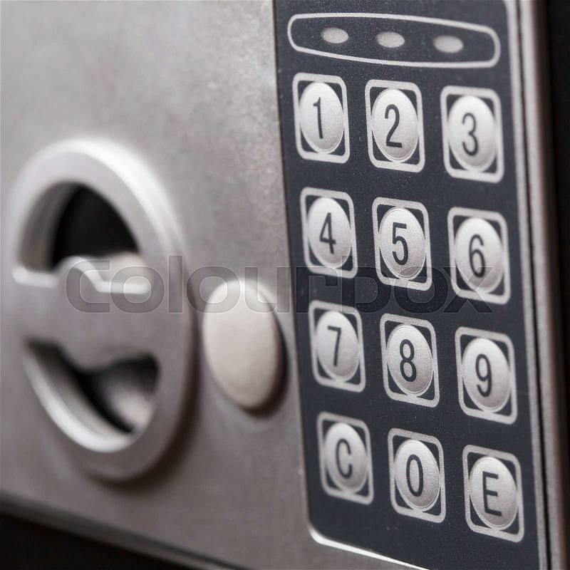 Electronic home safe keypad, Small home or hotel wall safe with keypad, closeup, stock photo