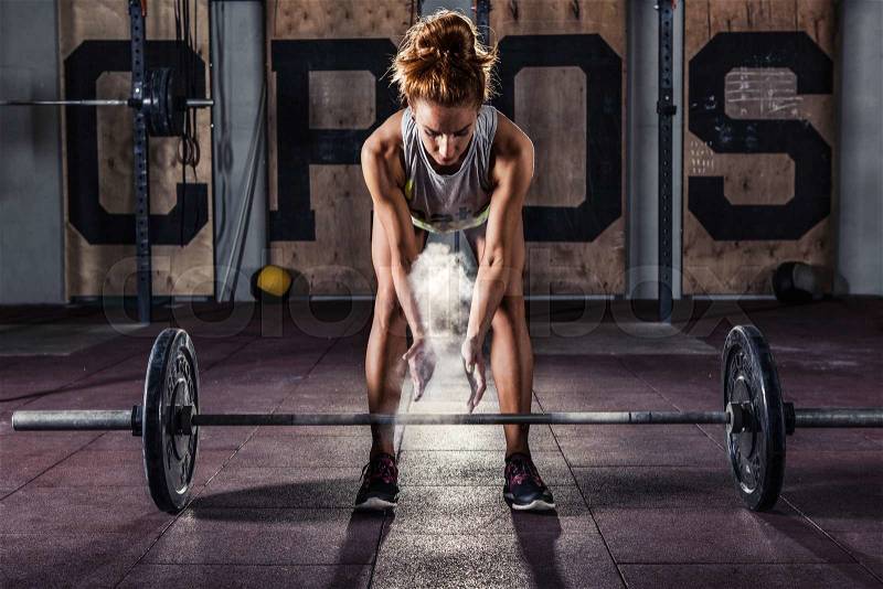 Girl getting ready for crossfit training, stock photo
