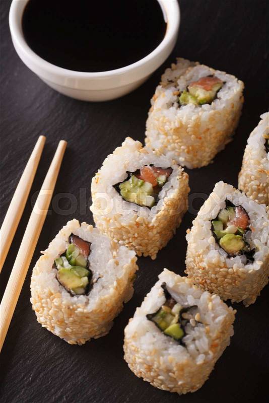 Japanese california roll served with soy sauce closeup. vertical view from above\, stock photo