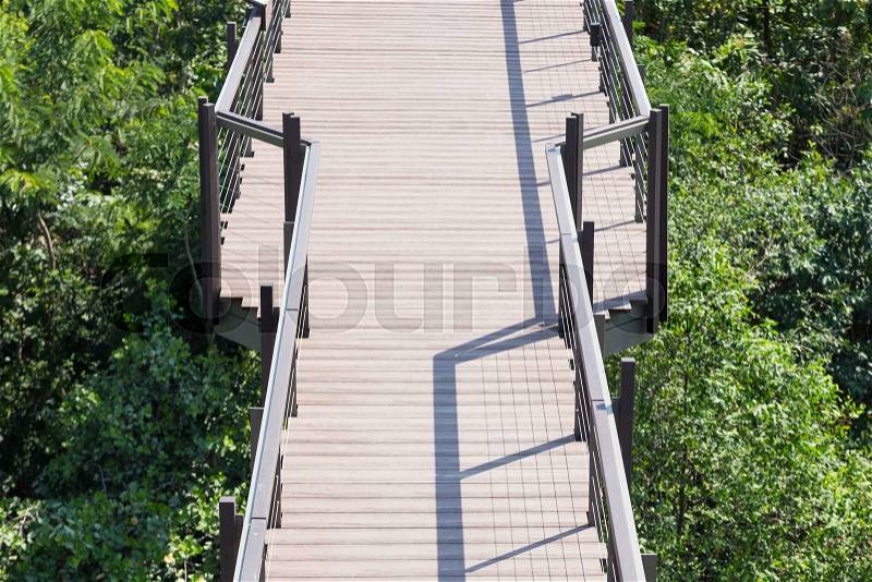 Bridge wooden walkway. The wooden walkway in the park to walk the tree, stock photo
