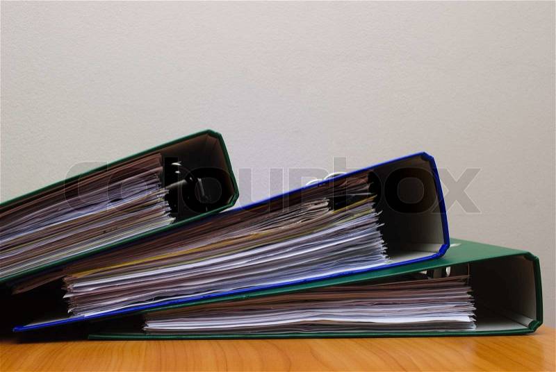 Stack of documents in folders on office desktop close-up. Shallow deep of field, stock photo