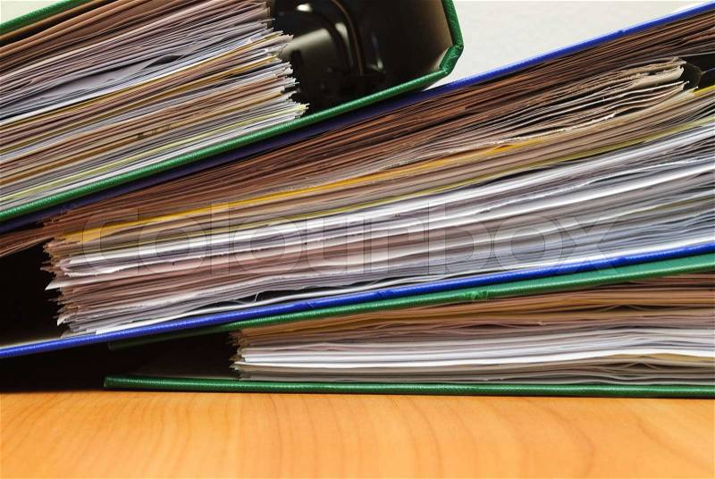 Stack of documents in folders on office desktop close-up. Shallow deep of field, stock photo