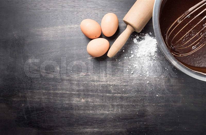 Bakery concept,Ingredients for making cake chocolate on a dark wooden background,top view, stock photo