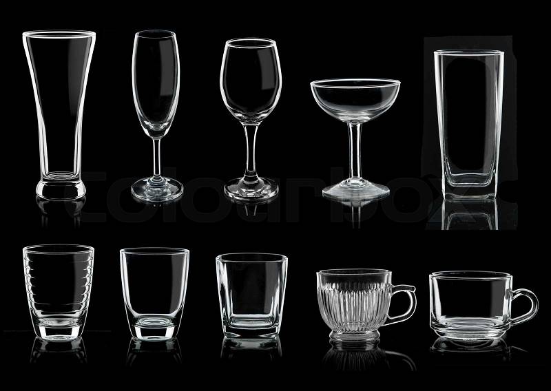 Collection of empty glasses and mugs on black background, stock photo
