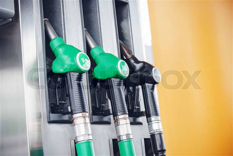 Fuel pump with gasoline and diesel with green and black handles, stock photo