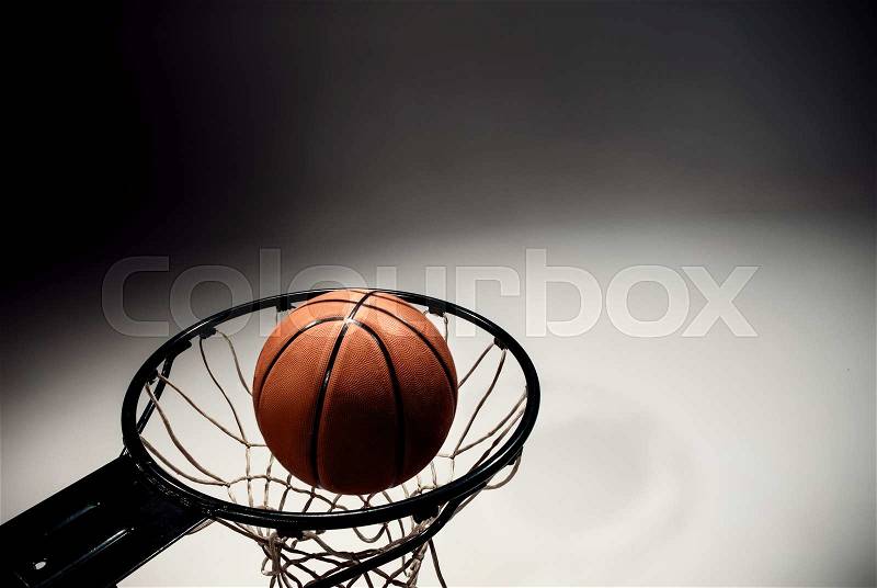Basketball board and basketball ball on gray background, stock photo
