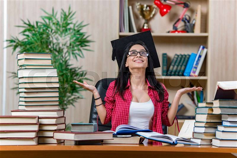 The young female student preparing for college school exams, stock photo