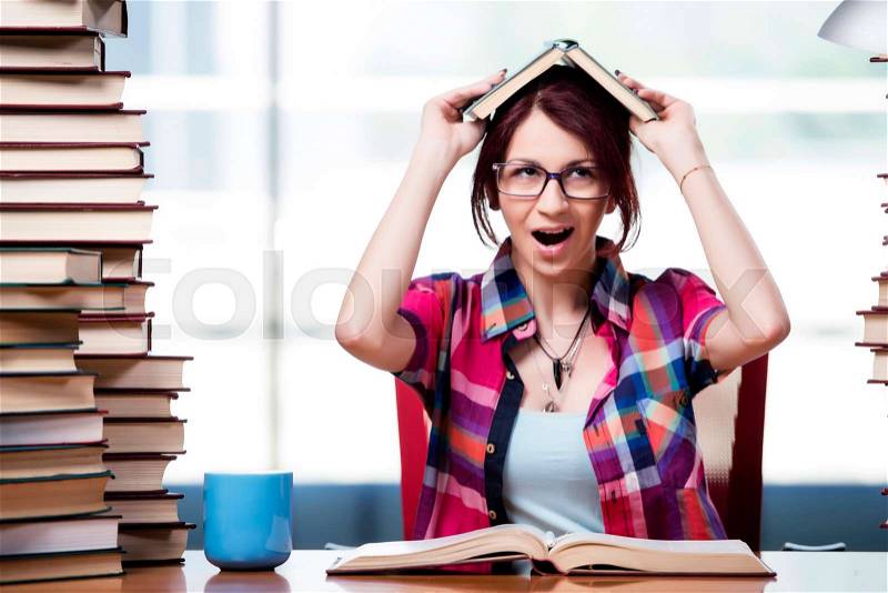 The young woman student preparing for college exams, stock photo