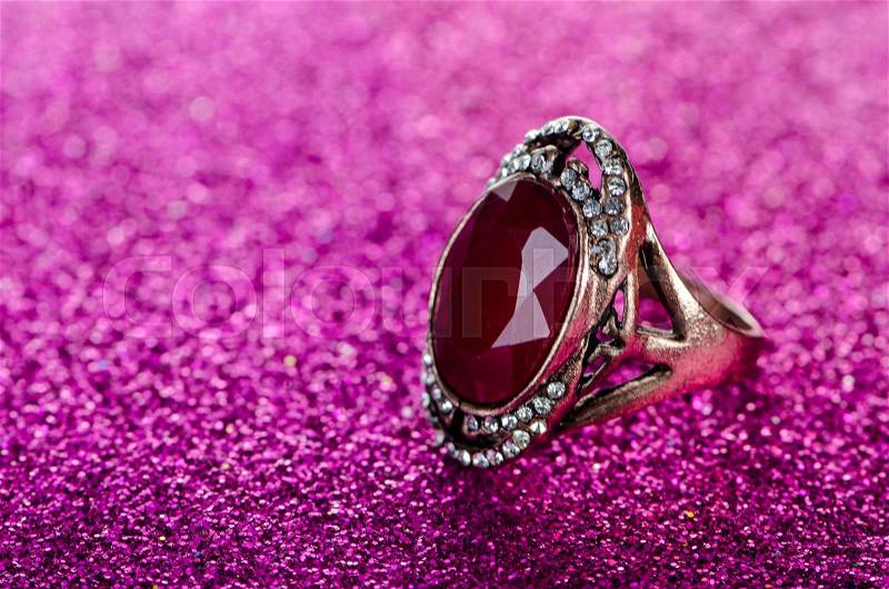 The jewellery ring against shiny background, stock photo