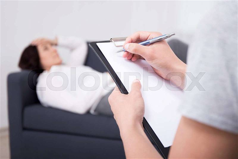 Mature woman talks about his problems to his psychologist, stock photo