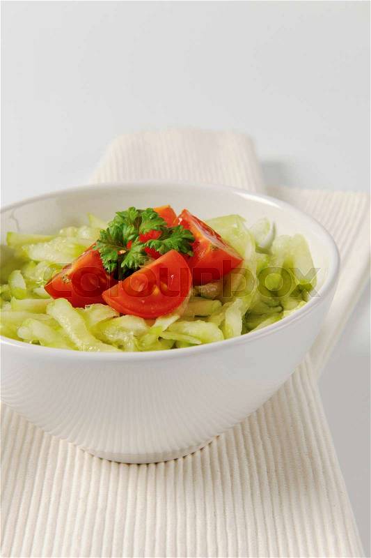 Fresh cucumber salad in vinegar dressing, stock photo