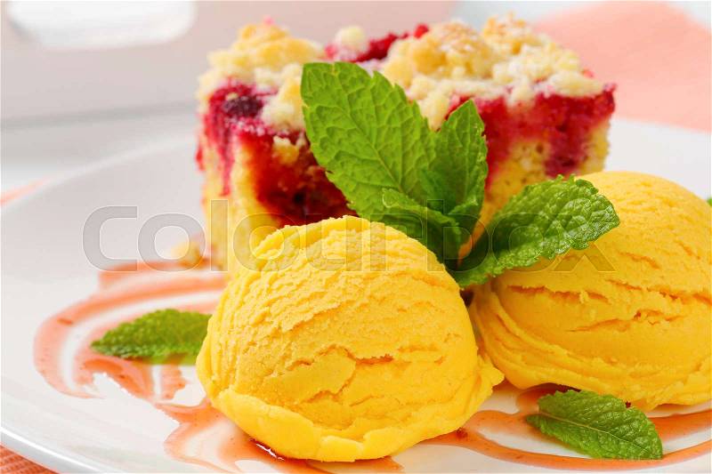 Piece of raspberry crumb cake with ice cream, stock photo