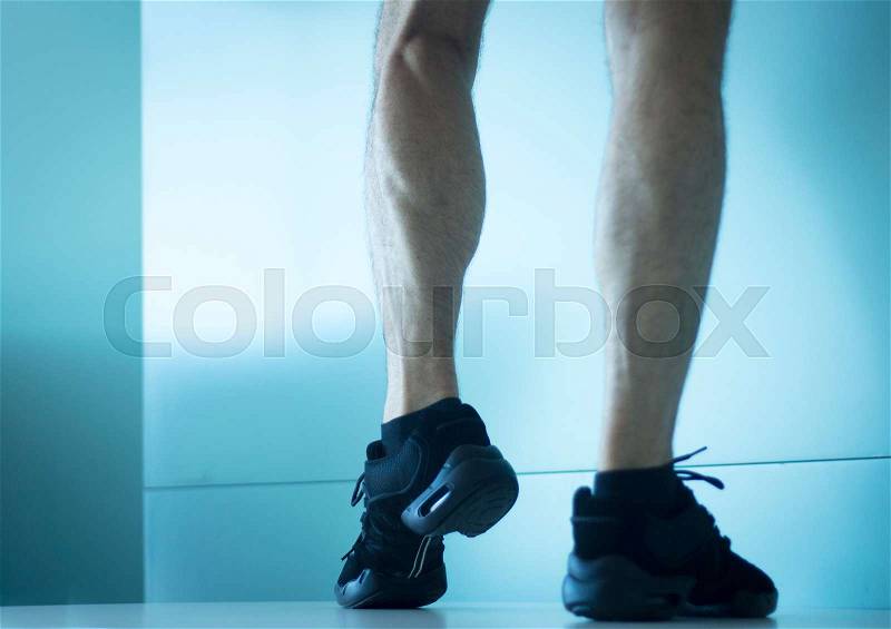 Male cardio dance fit dancer and man instructor giving dancing fitness class in gym, stock photo