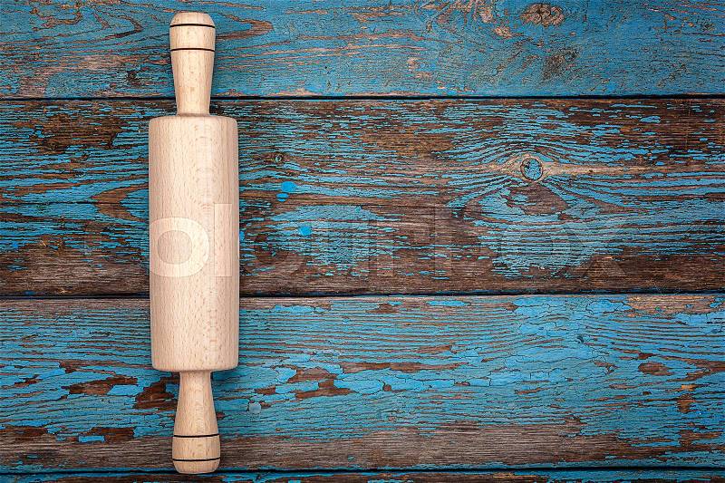 Rolling pin. Kitchenware on wooden background. Accessories for cooking, stock photo