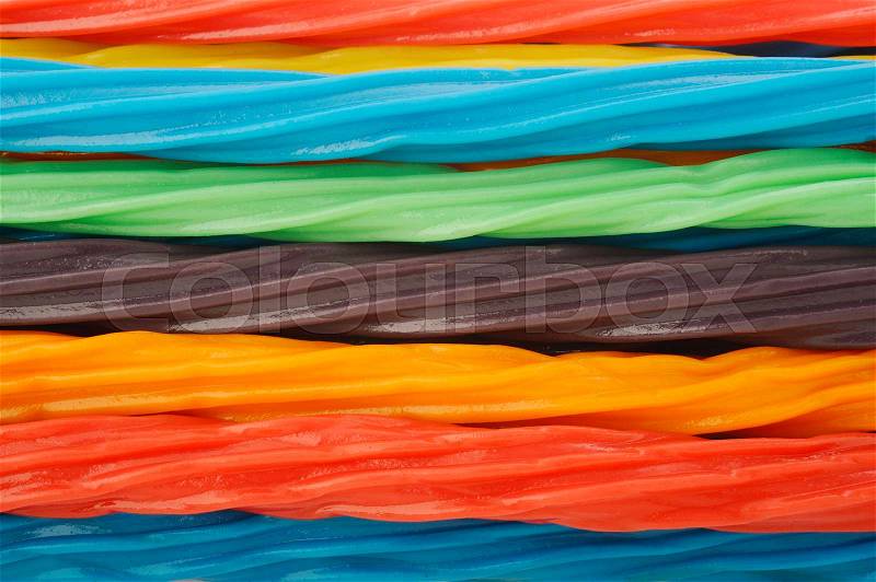 colorful licorice candy shaped like a twisted rope background, stock photo