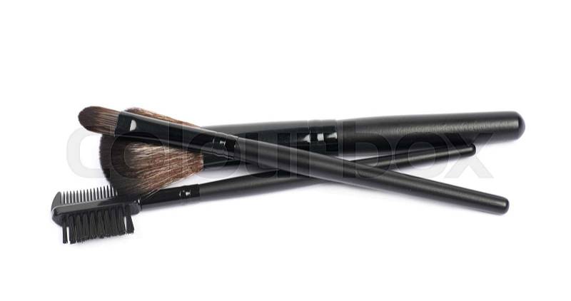 Pile of multiple black makeup tools and brushed isolated over the white background, stock photo