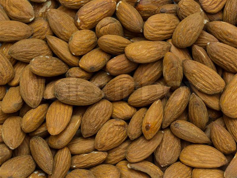 Background almond nuts close-up shot, stock photo