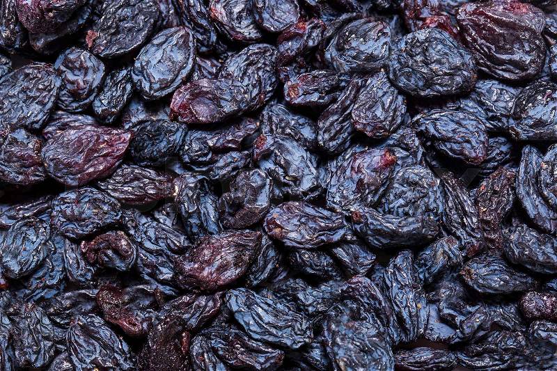 Background dried raisin grapes closeup shot, stock photo