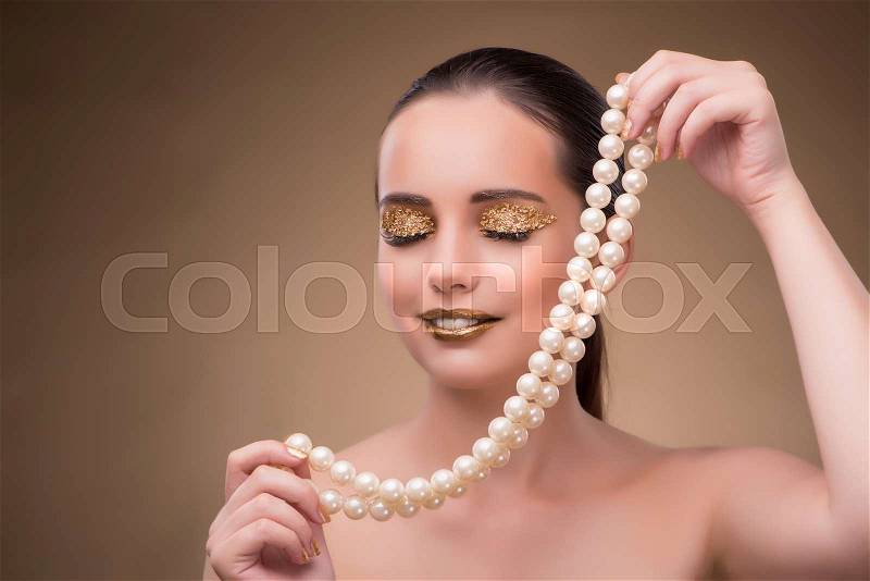Woman with pearl necklace isolated on white, stock photo