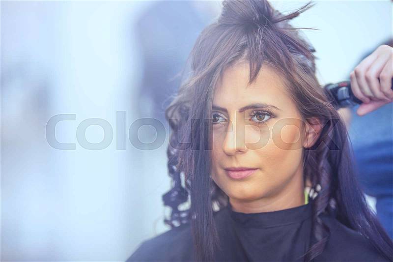Pretty young woman and hairdresser hair salon, stock photo