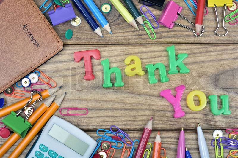 Thank You word and office tools on wooden table, stock photo