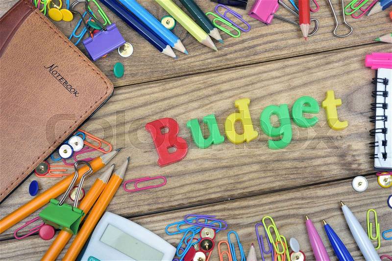Budget word and office tools on wooden table, stock photo
