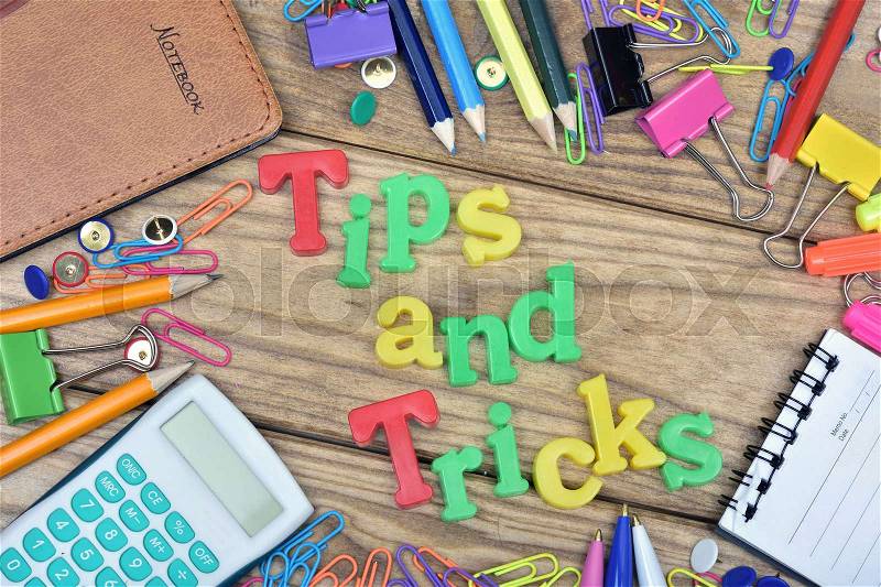 Tips and Tricks word and office tools on wooden table, stock photo