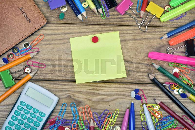 Post-it and office tools on wooden table, stock photo