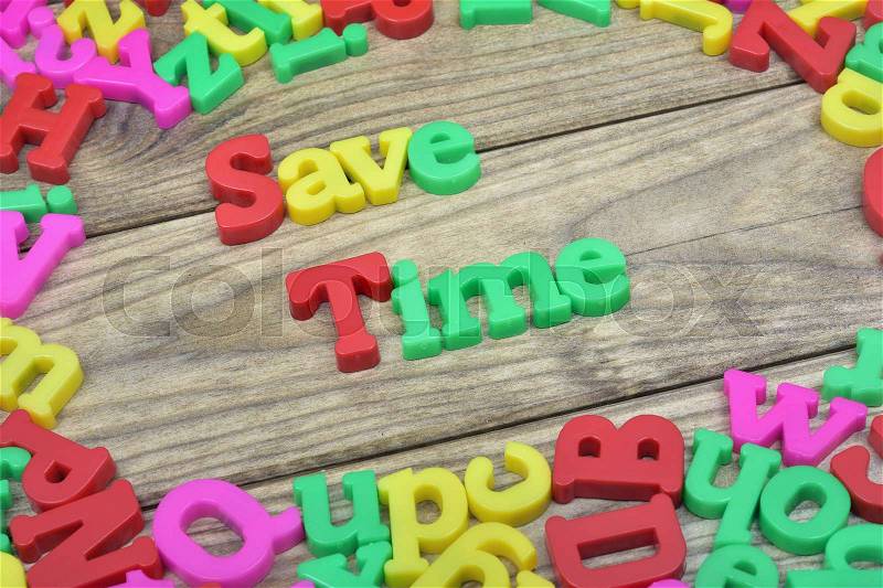 Save Time word on wooden table, stock photo