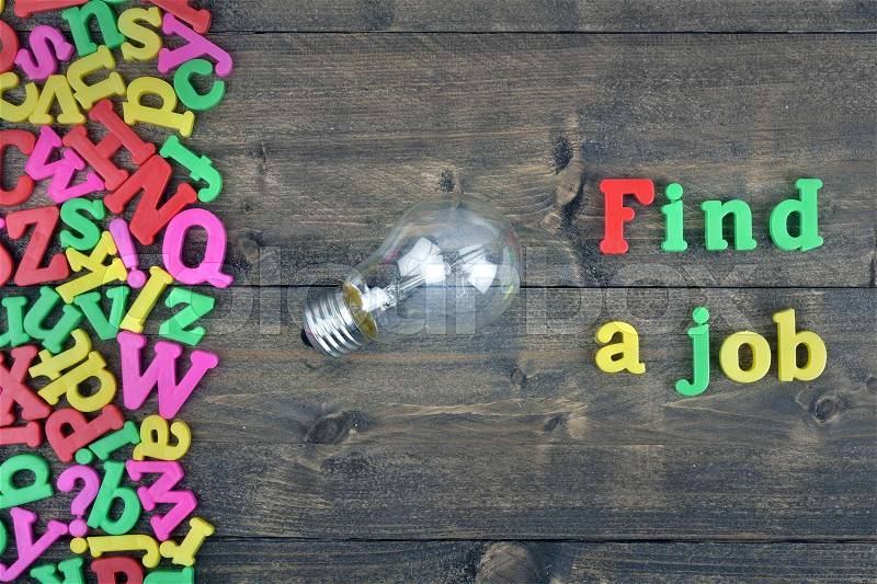 Find a job word on wooden table, stock photo