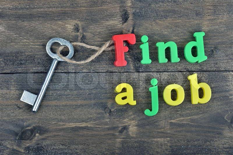 Find a job word on wooden table, stock photo