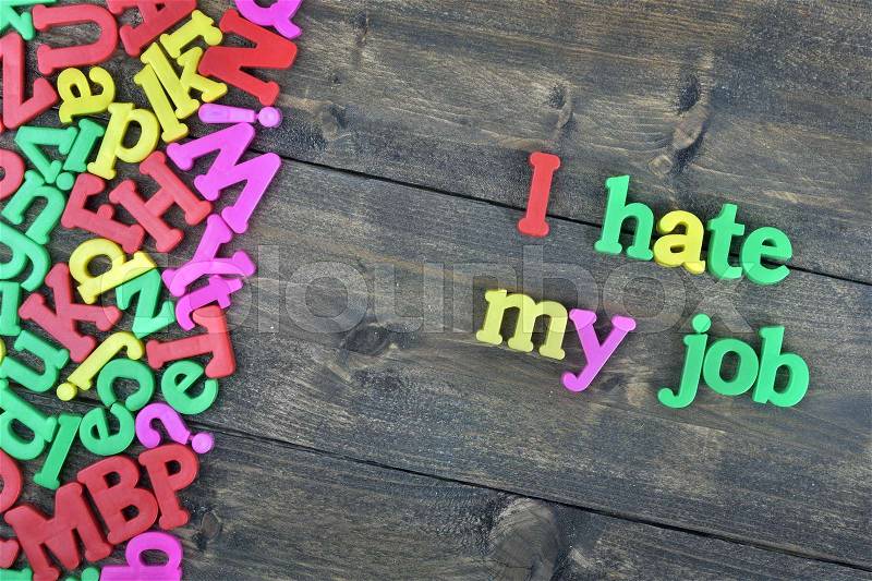 I hate my job word on wooden table, stock photo